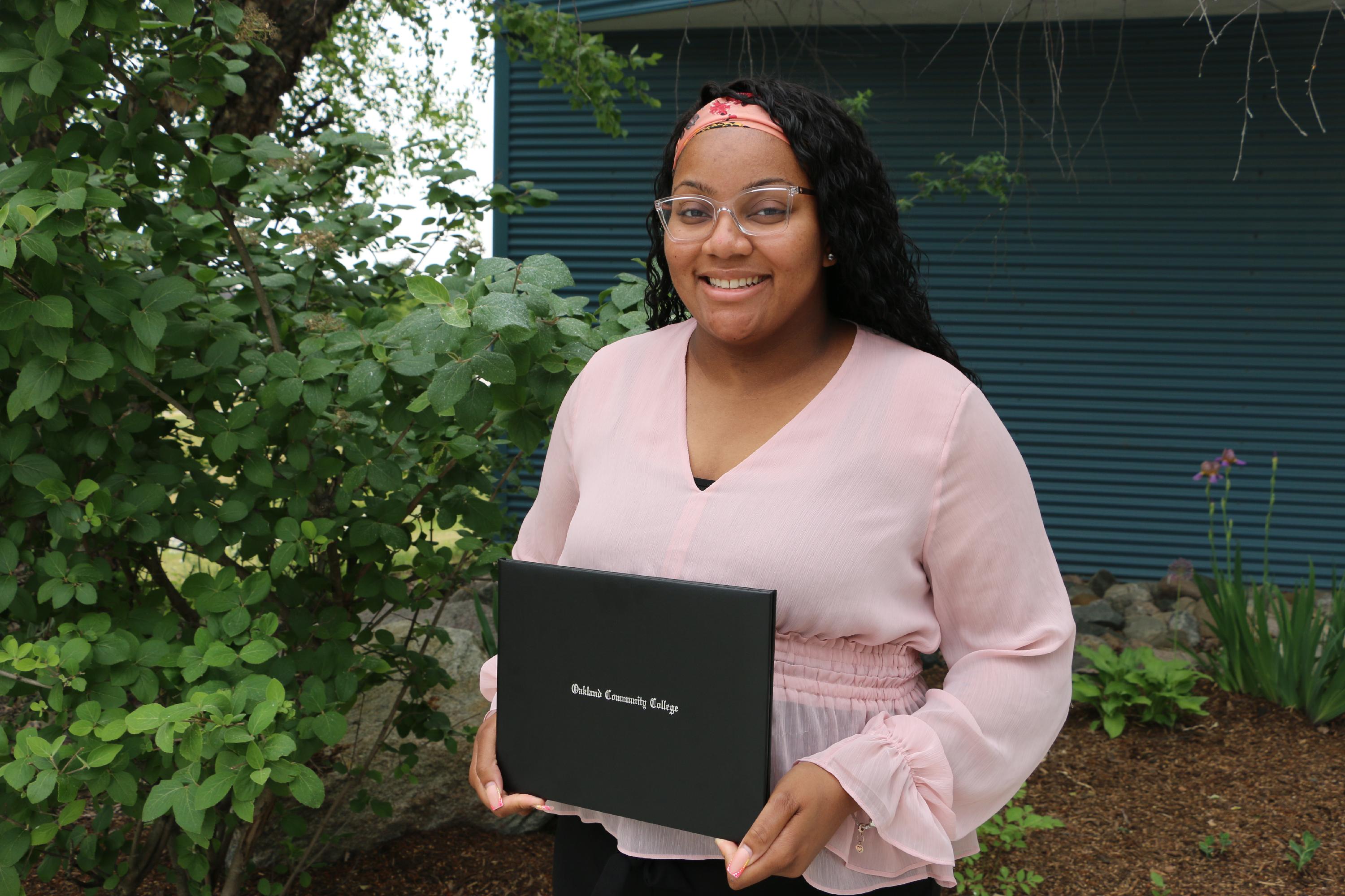 Student with certificate 